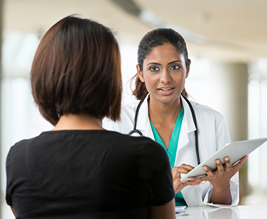 Female doctor talking with patient